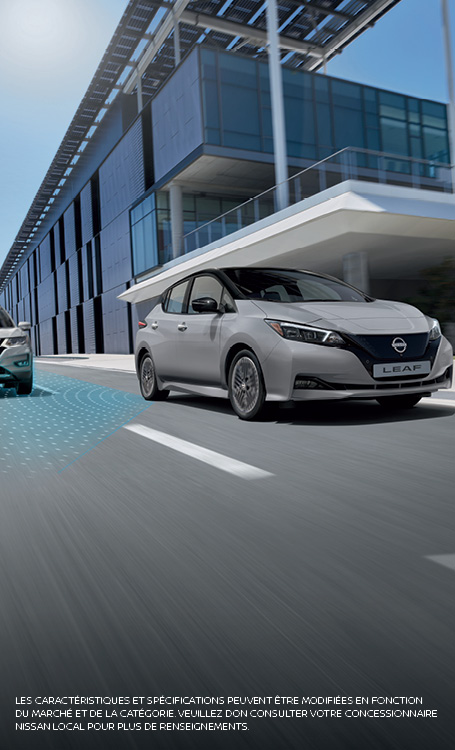 Nissan Leaf driving in town